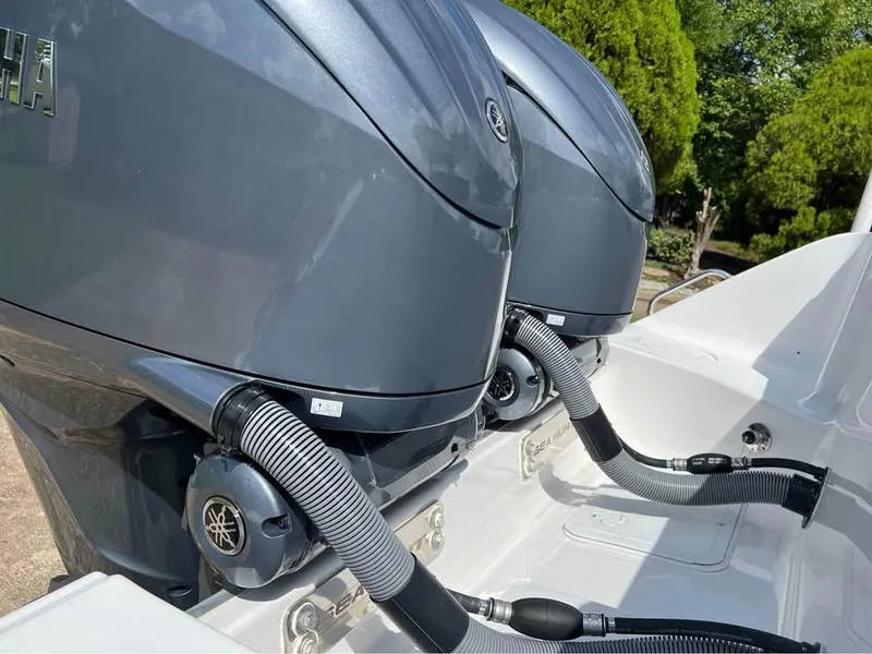 Slide: The Image of Twin Yamaha outboard engines on a 2022 Sea Hunt Gamefish 27 boat. - 13
