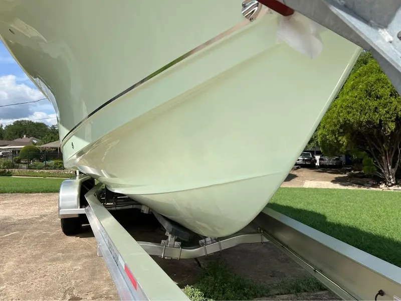 Slide: The Image of 2022 Sea Hunt Gamefish 27 boat on trailer, side view, outdoors. - 19