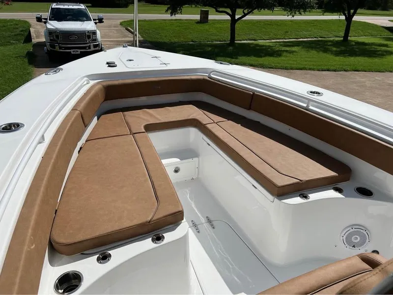 Slide: The Image of 2022 Sea Hunt Gamefish 27 boat with tan seating and white deck. - 5
