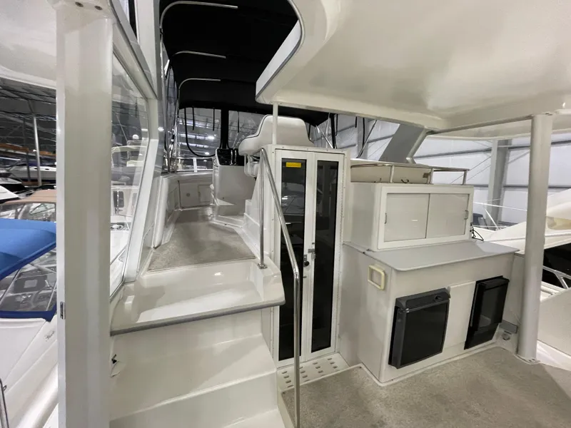 Slide: The Image of 1995 Carver 440 Aft Cabin Motor Yacht interior with spacious deck and modern amenities. - 13