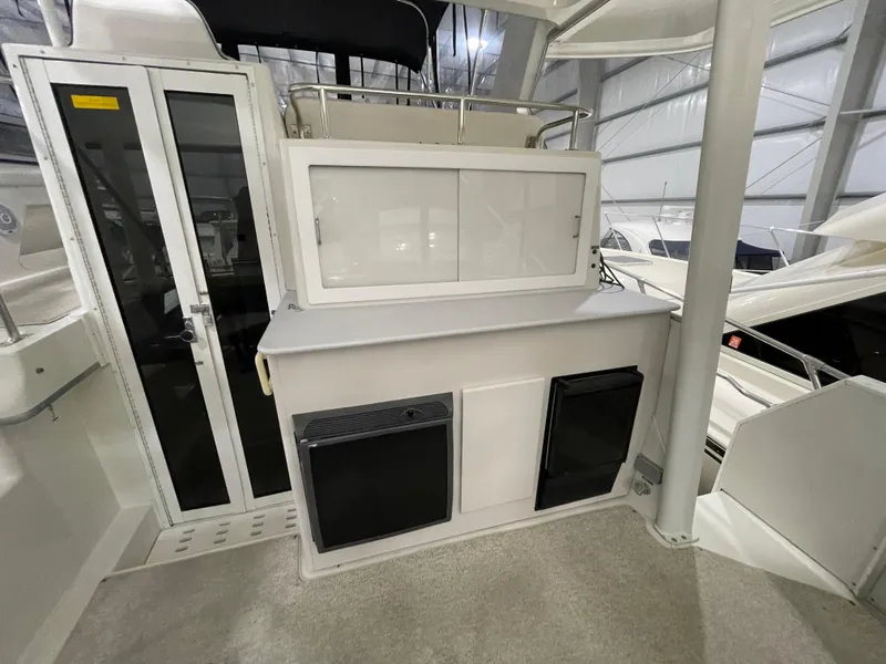 Slide: The Image of 1995 Carver 440 Aft Cabin Motor Yacht interior with storage and appliances. - 14