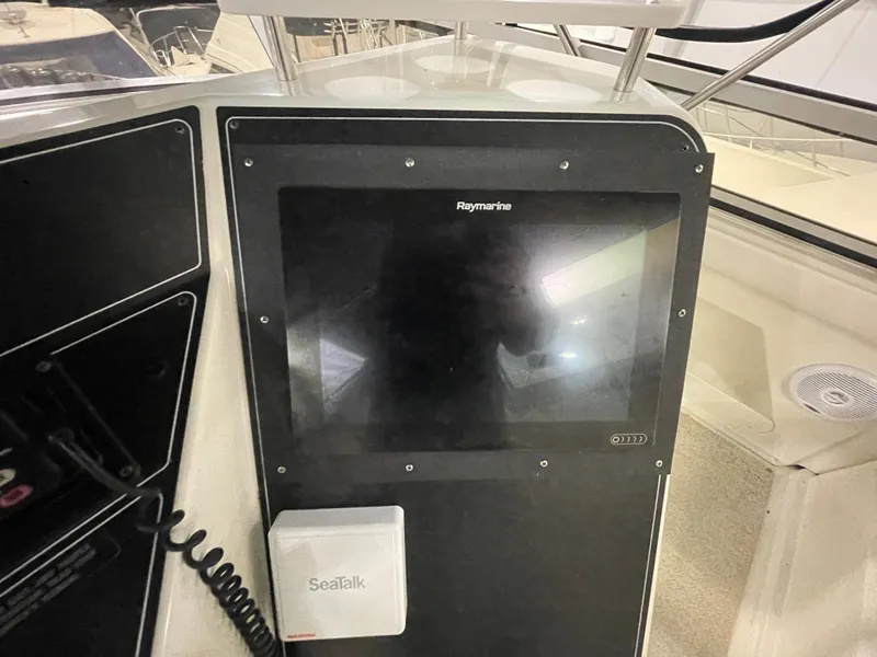 Slide: The Image of Control panel of a 1995 Carver 440 Aft Cabin Motor Yacht with Raymarine display. - 18