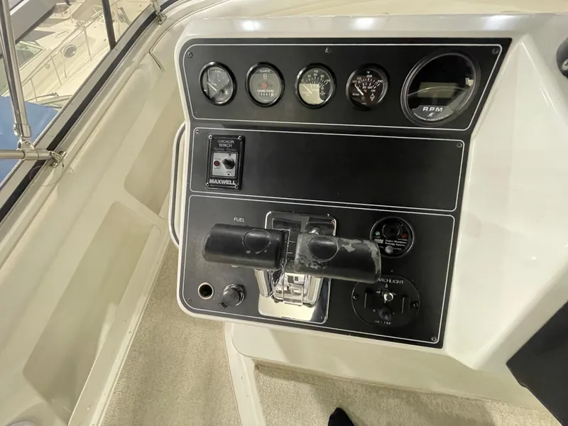 Slide: The Image of Control panel of a 1995 Carver 440 Aft Cabin Motor Yacht with gauges and switches. - 20