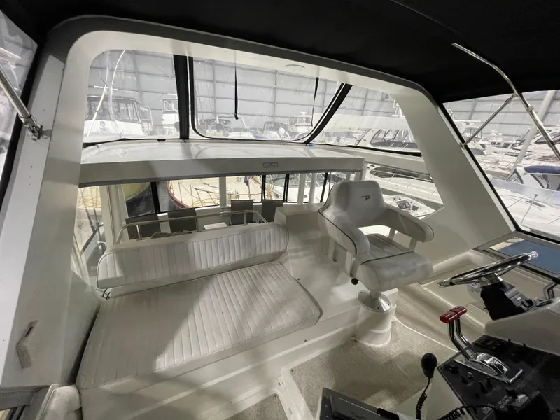 Slide: The Image of Interior view of 1995 Carver 440 Aft Cabin Motor Yacht helm station. - 22