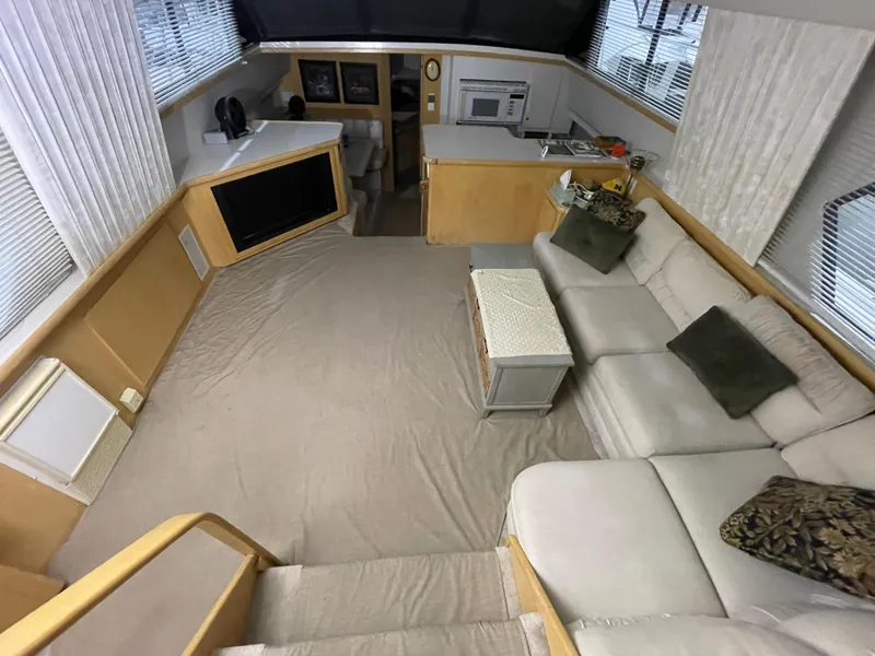 Slide: The Image of Spacious interior of 1995 Carver 440 Aft Cabin Motor Yacht with modern amenities. - 23