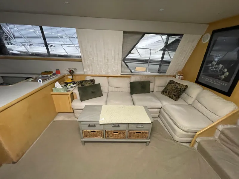 Slide: The Image of 1995 Carver 440 Aft Cabin Motor Yacht interior with cozy seating and modern decor. - 24
