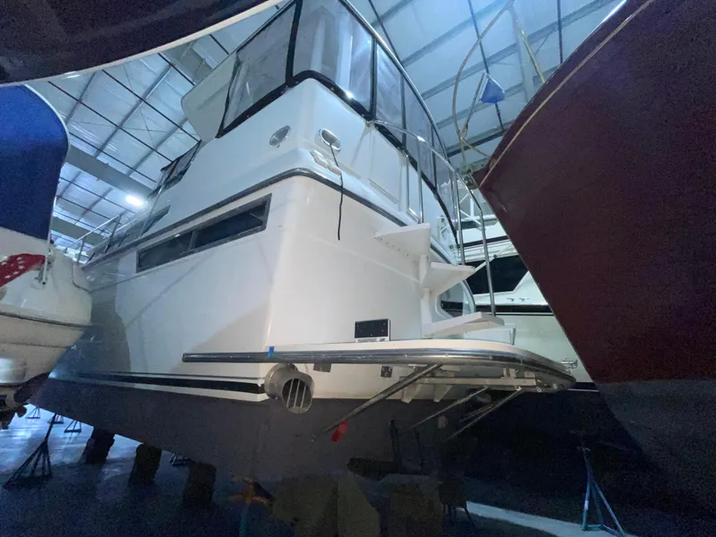 Slide: The Image of 1995 Carver 440 Aft Cabin Motor Yacht in storage, side view. - 8