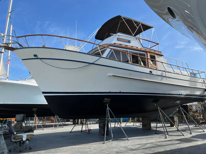 Slide: The Image of 1984 DeFever 41 Trawler on dry dock, showcasing classic design and sturdy construction. - 23
