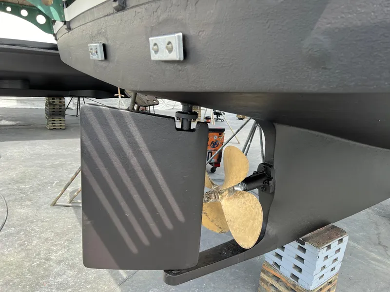 Slide: The Image of 1984 DeFever 41 Trawler propeller and rudder detail on dry dock. - 24