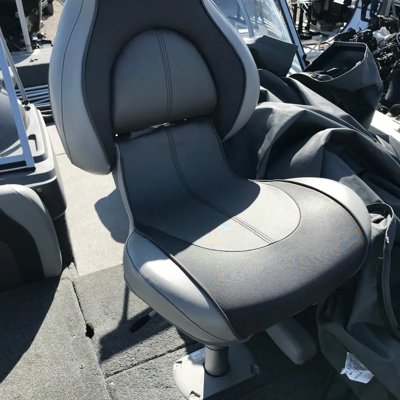 Slide: The Image of 2016 Crestliner 1850 Super Hawk boat seat, gray and black, on deck. - 13
