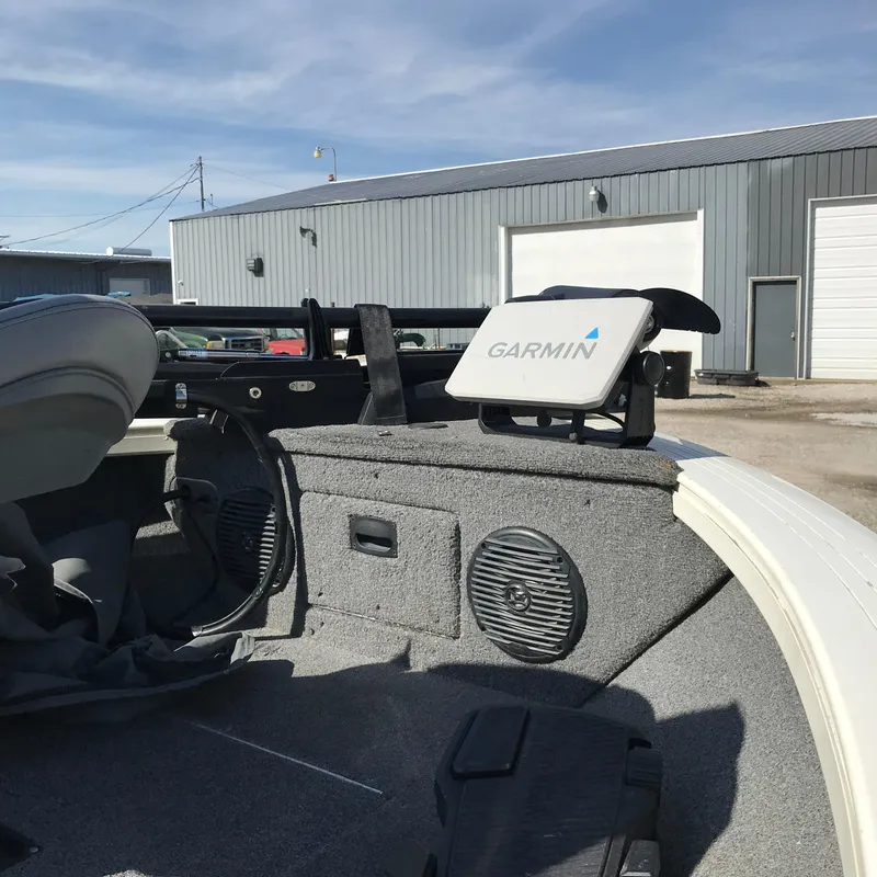 Slide: The Image of 2016 Crestliner 1850 Super Hawk interior with Garmin device, speakers, and storage compartments. - 14