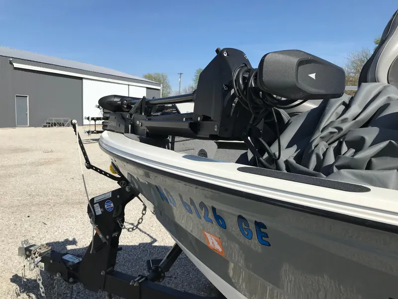 Slide: The Image of 2016 Crestliner 1850 Super Hawk boat on trailer, parked outdoors near a building. - 3