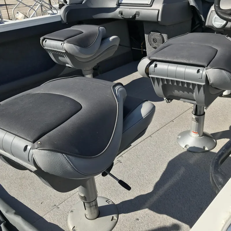 Slide: The Image of 2016 Crestliner 1850 Super Hawk interior with swivel seats and console. - 8
