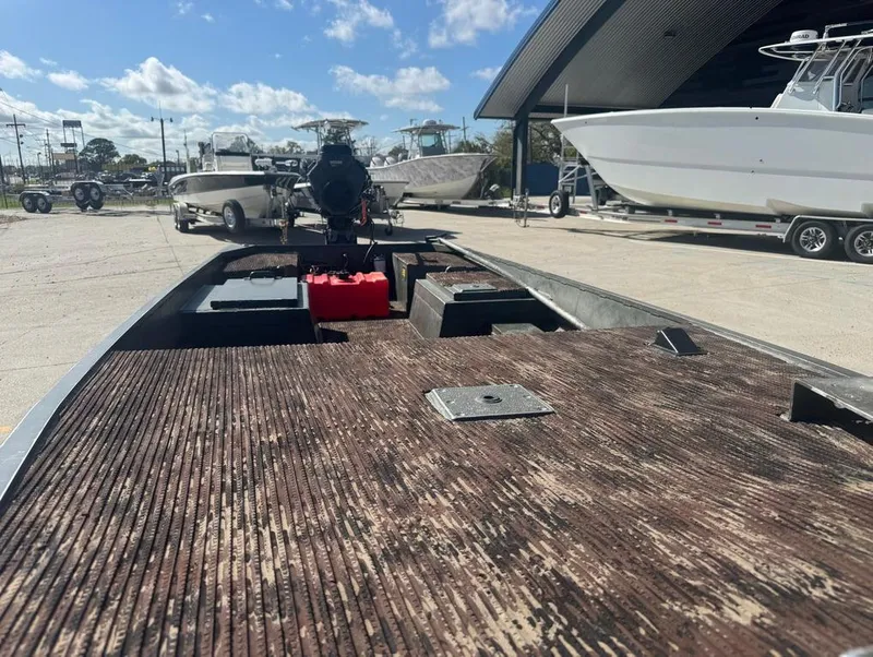 Slide: The Image of 2018 Go-Devil 18x48 Surface Drive Boat on display at a marina. - 12