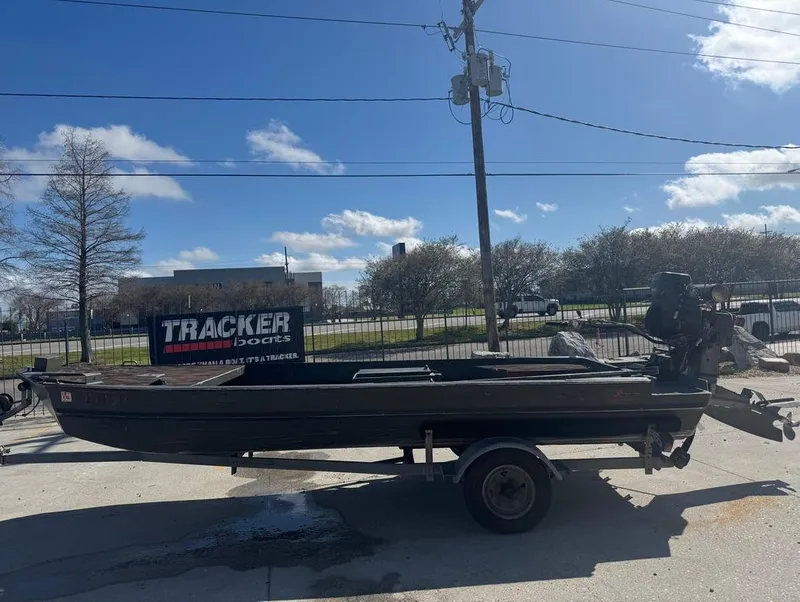 Slide: The Image of 2018 Go-Devil 18x48 Surface Drive Boat on trailer, parked outdoors under clear sky. - 2