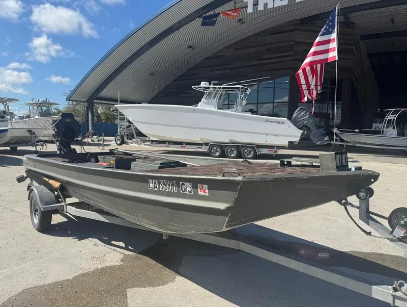 Slide: The Image of 2018 Go-Devil 18x48 Surface Drive Boat on trailer, American flag, outdoor showroom. - 5