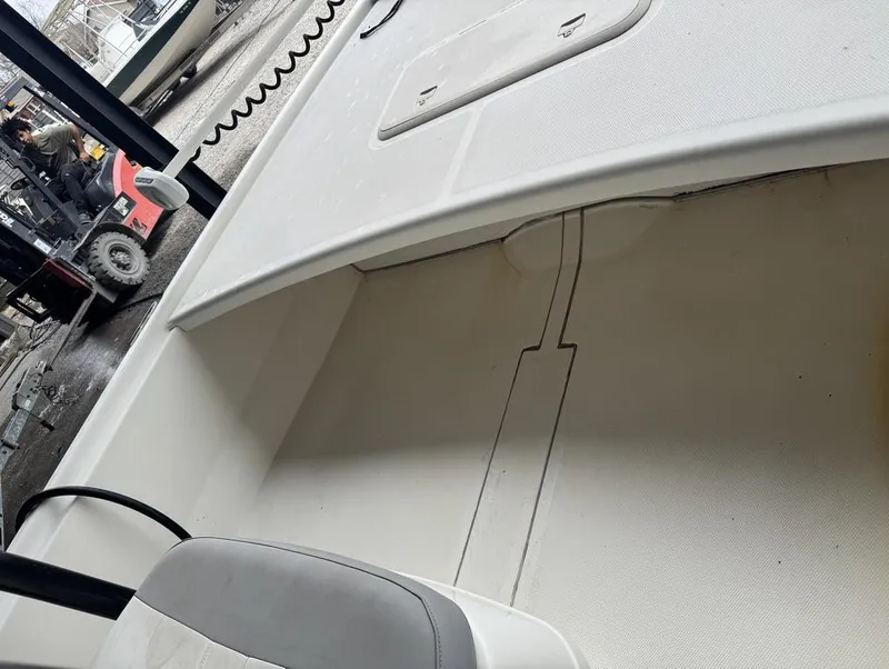 Slide: The Image of 2018 Mako Pro Skiff 19 CC Top Drive interior view, showcasing seating and deck details. - 6