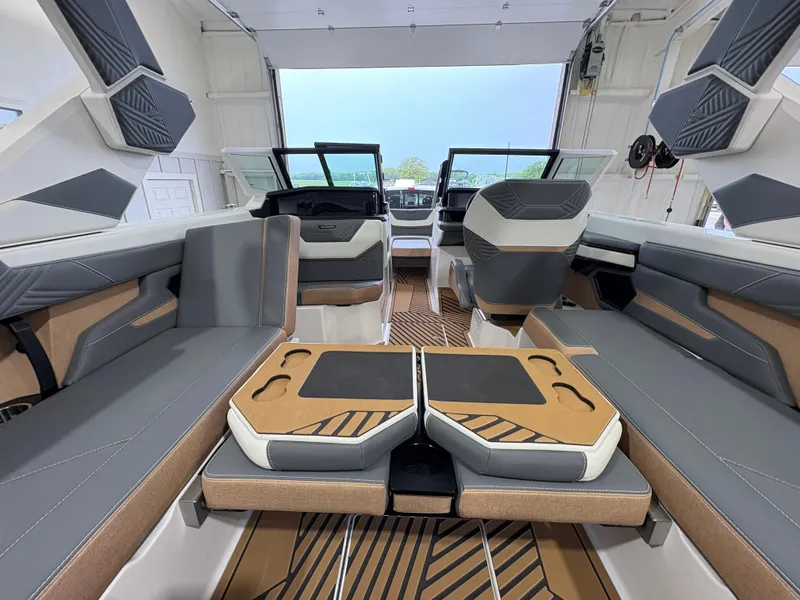 Slide: The Image of 2025 MasterCraft XStar 23 boat storage compartment with stylish interior design. - 11