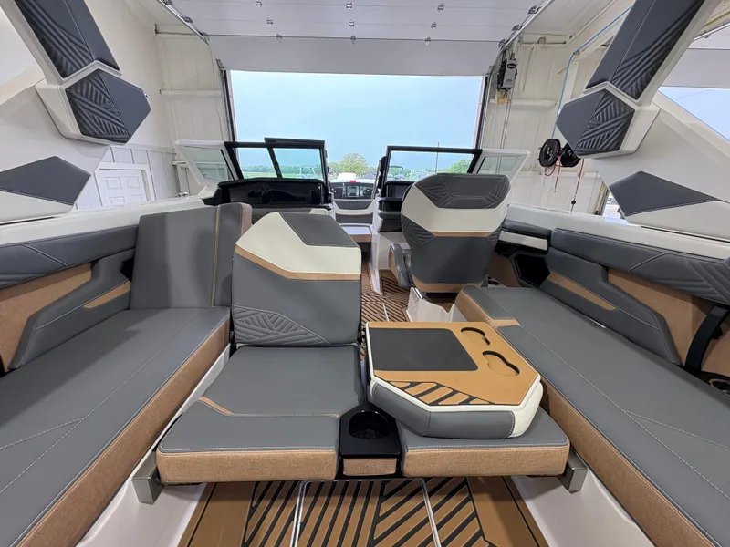 Slide: The Image of 2025 MasterCraft XStar 23 dashboard with advanced digital controls and steering wheel. - 13