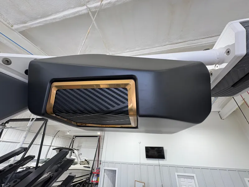 Slide: The Image of 2025 MasterCraft XStar 23 boat cockpit with advanced digital displays and steering wheel. - 14