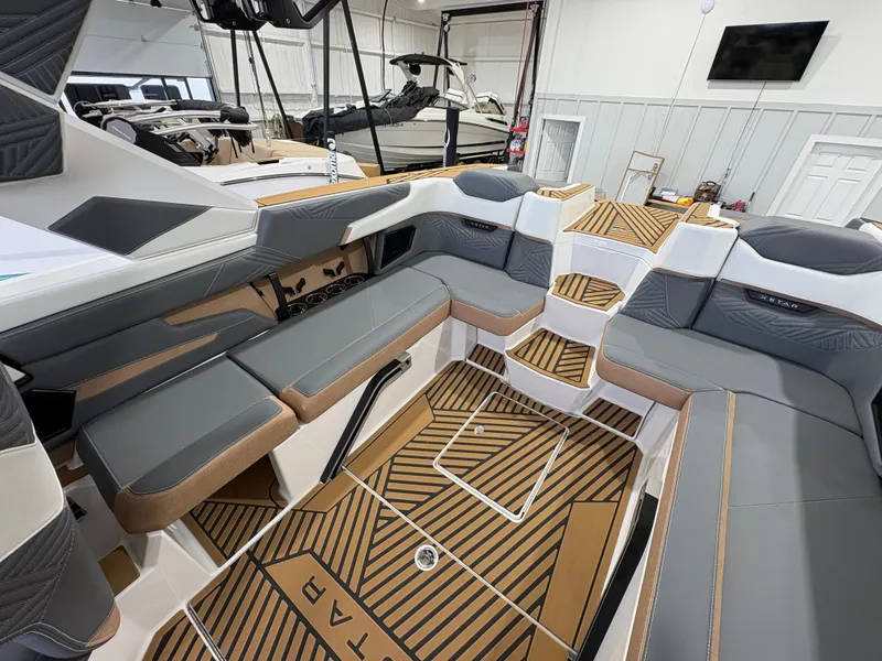 Slide: The Image of 2025 MasterCraft XStar 23 boat deck with stylish geometric design. - 17