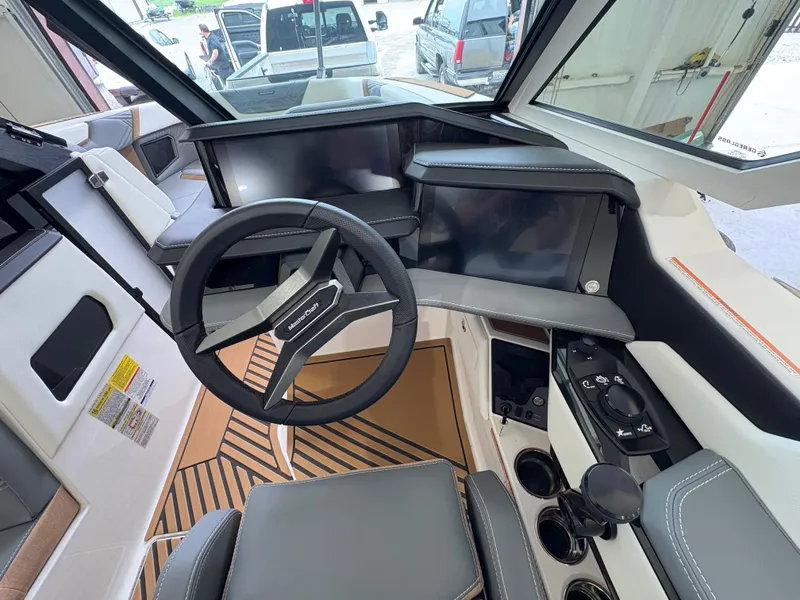 Slide: The Image of 2025 MasterCraft XStar 23 boat interior with stylish seating and modern design. - 20