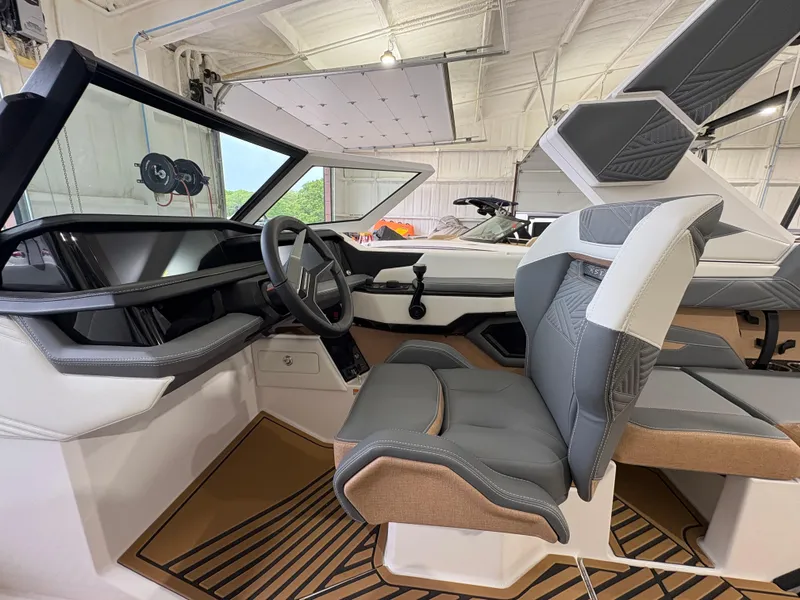 Slide: The Image of 2025 MasterCraft XStar 23 boat interior with sleek seating and modern design. - 21