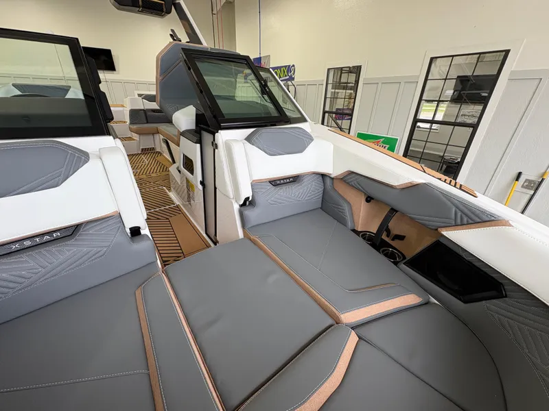 Slide: The Image of 2025 MasterCraft XStar 23 boat with teak deck in showroom. - 24