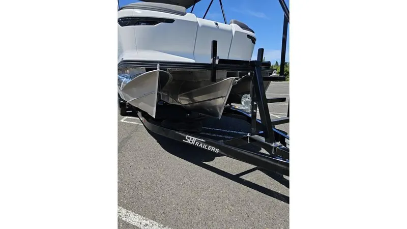 Slide: The Image of 2025 Manitou 20 CRUISE MAX with 150hp Rotax Stealth Motor on trailer. - 19