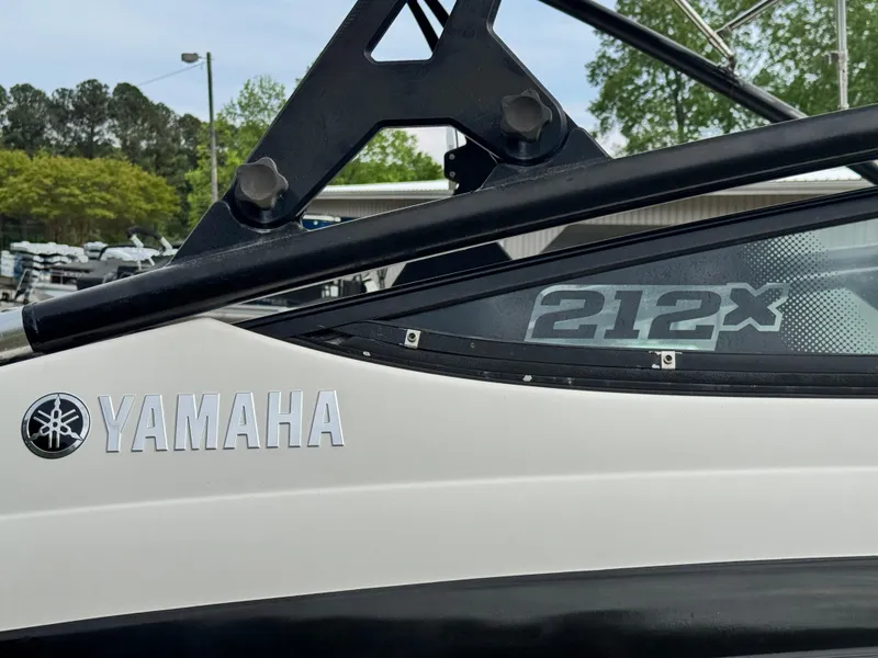 Slide: The Image of 2014 Yamaha Boats 212X, close-up of logo and model name on the side. - 3