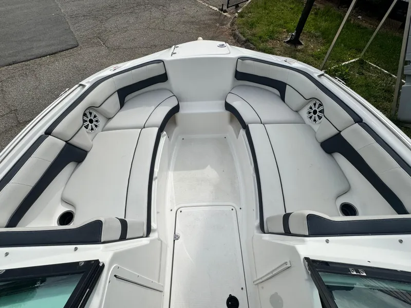 Slide: The Image of 2014 Yamaha Boats 212X interior with spacious seating and sleek design. - 9