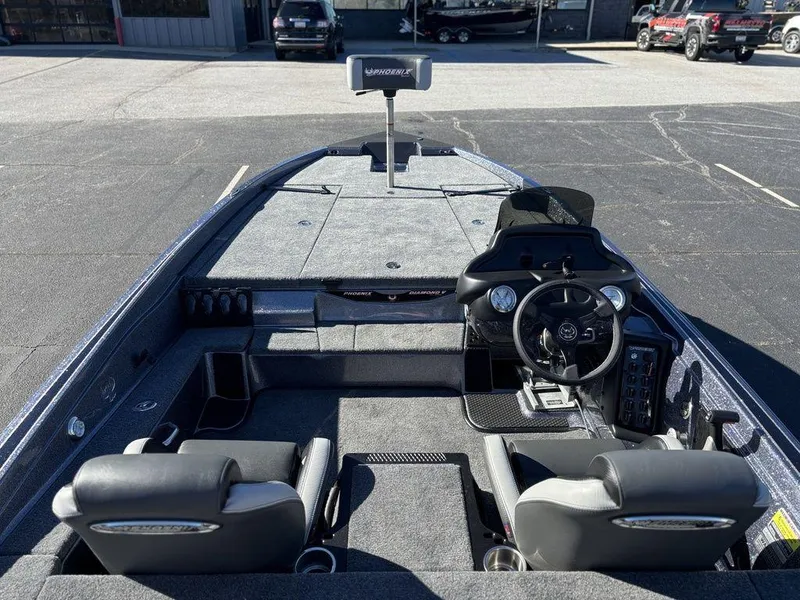 Slide: The Image of 2025 Phoenix 721 ZXL boat interior with dual seats and steering console. - 10