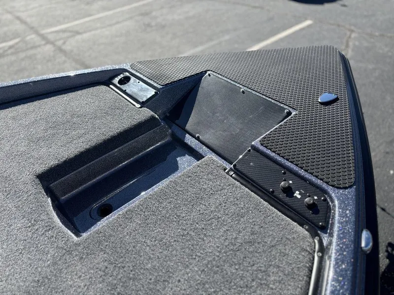 Slide: The Image of 2025 Phoenix 721 ZXL boat deck with textured surface and storage compartments. - 12