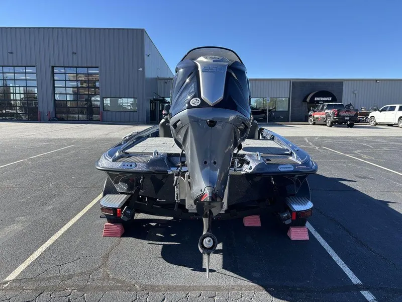 Slide: The Image of 2025 Phoenix 721 ZXL boat in parking lot, rear view, sunny day. - 3