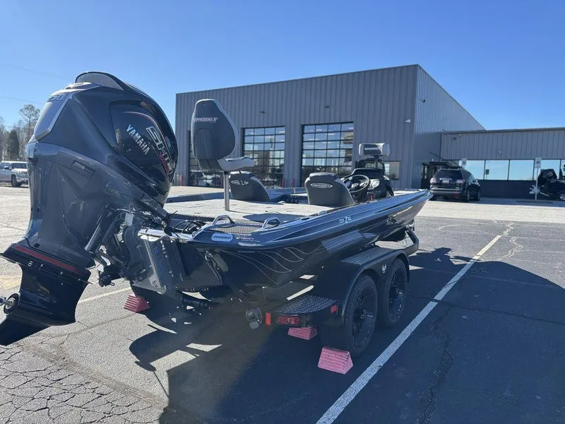 Slide: The Image of 2025 Phoenix 721 ZXL boat with powerful engine, parked outside a modern building. - 4