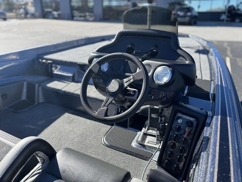 Slide: The Image of 2025 Phoenix 721 ZXL boat interior with steering wheel and control panel. - 5