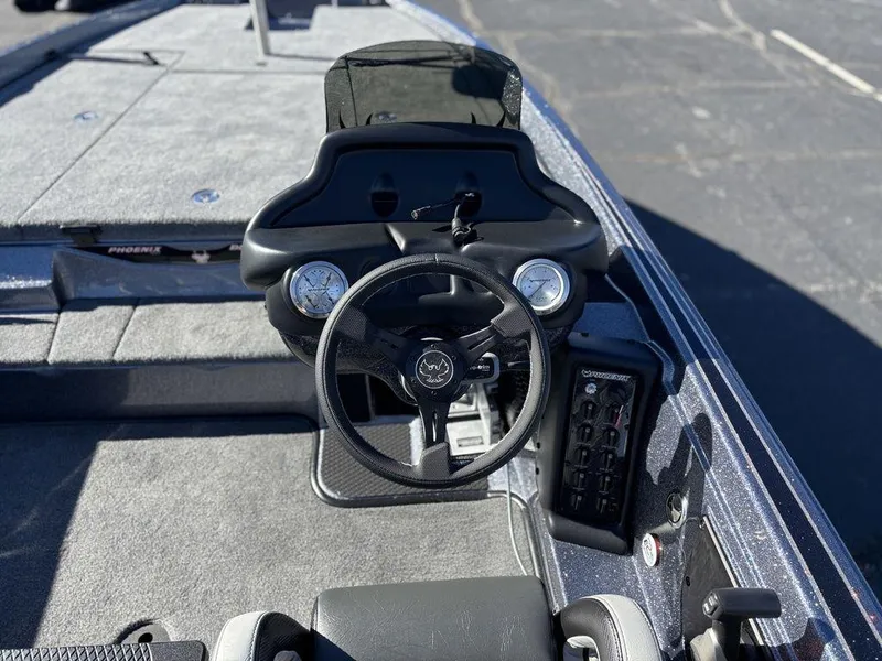 Slide: The Image of 2025 Phoenix 721 ZXL boat cockpit with steering wheel and control panel. - 6
