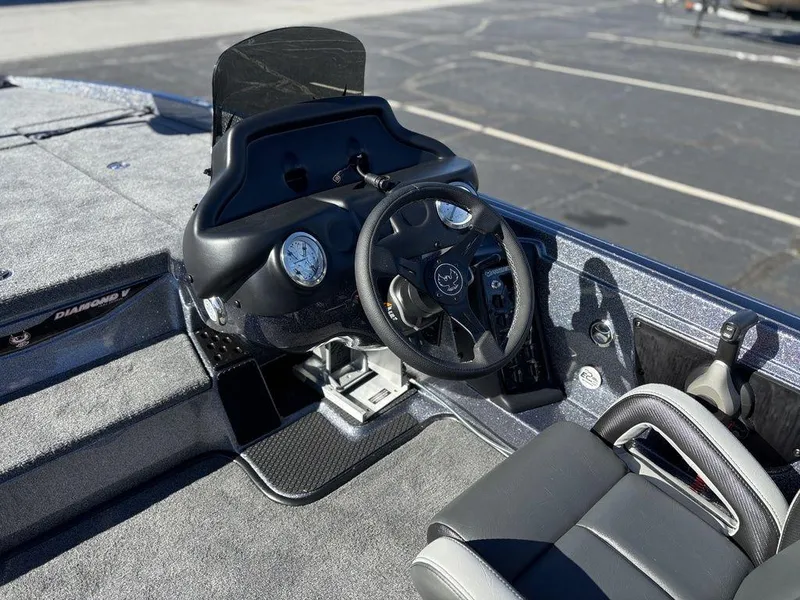 Slide: The Image of 2025 Phoenix 721 ZXL boat cockpit with steering wheel and dashboard controls. - 7