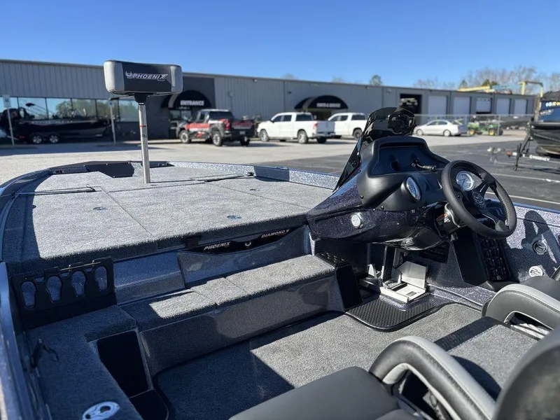 Slide: The Image of 2025 Phoenix 721 ZXL boat interior with steering wheel and spacious deck. - 8