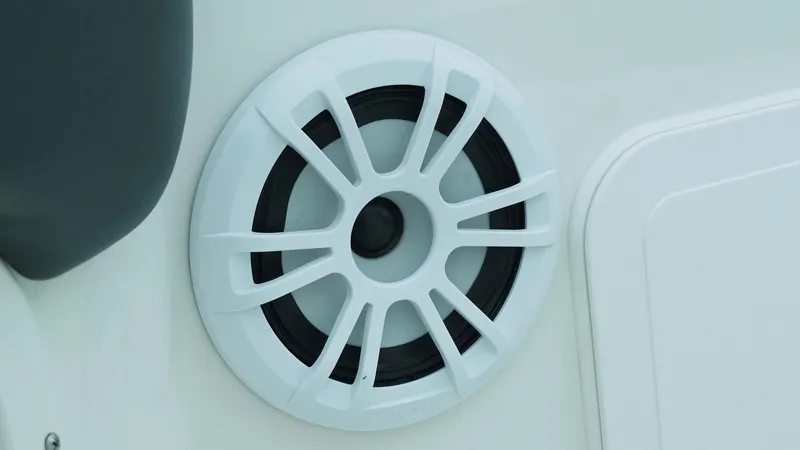 Slide: The Image of White speaker on 2019 Stingray 206 CC boat interior. - 15