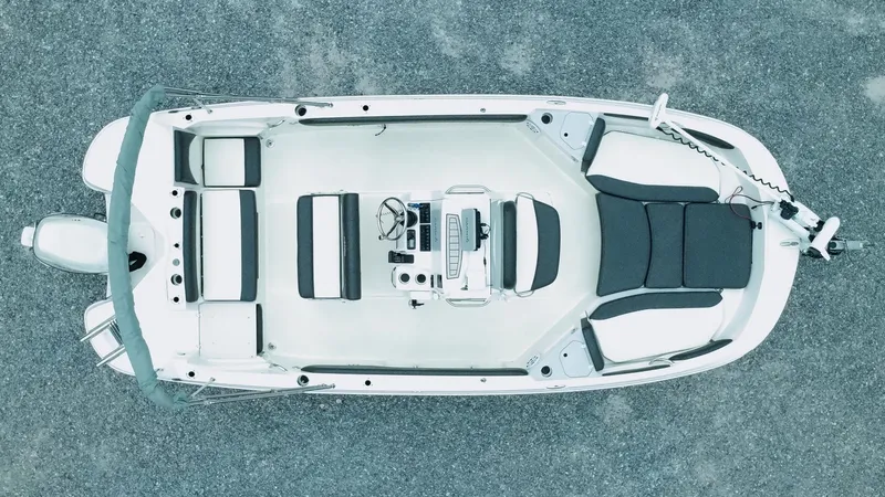 Slide: The Image of Overhead view of a 2019 Stingray 206 CC boat on gravel surface. - 2