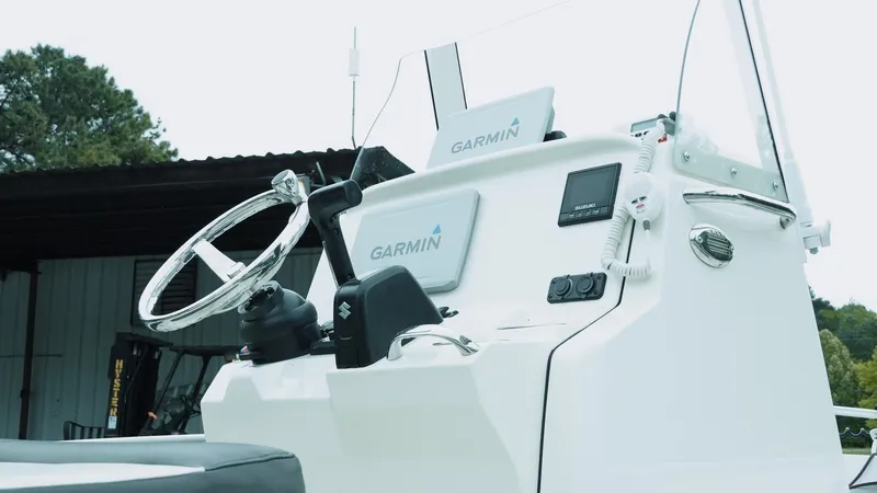 Slide: The Image of 2019 Stingray 206 CC boat dashboard with Garmin navigation system. - 7