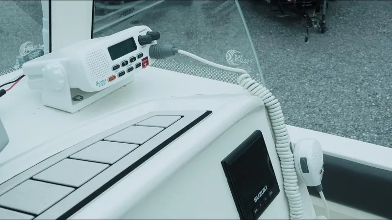 Slide: The Image of 2019 Stingray 206 CC boat dashboard with radio and control panel. - 8