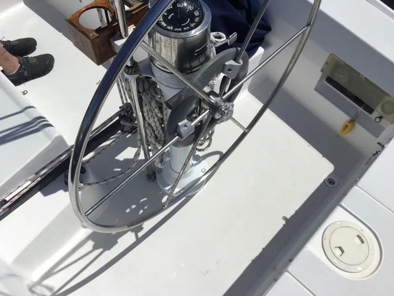 Slide: The Image of Steering wheel and compass on a 1997 J Boats J/32 sailboat deck. - 20