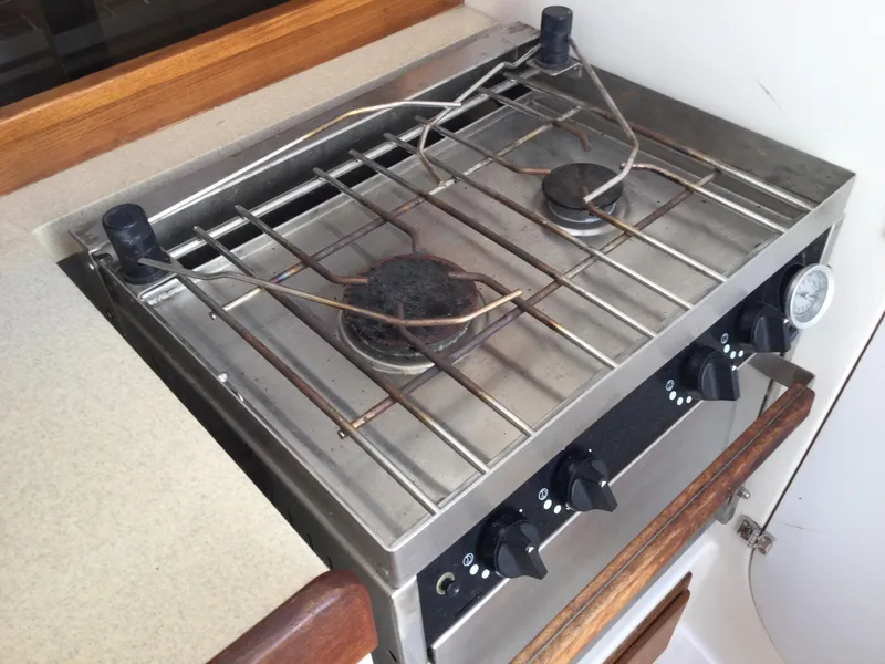 Slide: The Image of Stainless steel stove on 1997 J Boats J/32 yacht, featuring two burners and control knobs. - 31