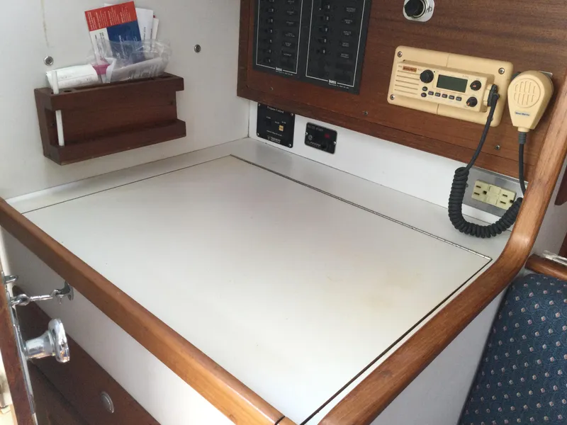 Slide: The Image of Navigation station on a 1997 J Boats J/32 sailboat with radio and control panel. - 34