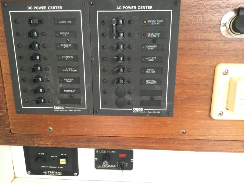 Slide: The Image of Electrical panel on a 1997 J Boats J/32, featuring DC and AC power controls. - 35