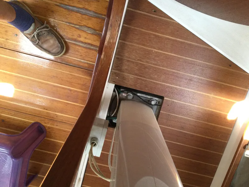 Slide: The Image of Interior view of a 1997 J Boats J/32 sailboat, showcasing wooden flooring and mast base. - 40