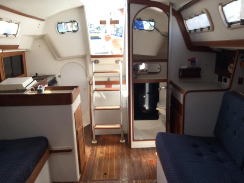 Slide: The Image of Interior of 1997 J Boats J/32 sailboat with wooden flooring and compact layout. - 44