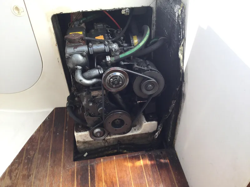 Slide: The Image of Engine compartment of a 1997 J Boats J/32 sailboat, featuring visible mechanical components. - 50